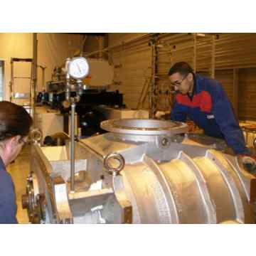 Hibon after-sales service workers repairing large rotary piston process blowers dedicated to the nuclear industry. 